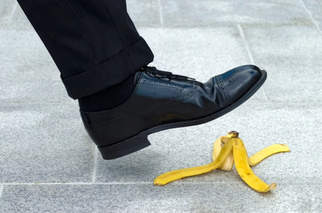 person is going to step on a banana peel