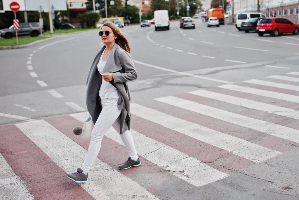 girl in gray coat with sunglasses